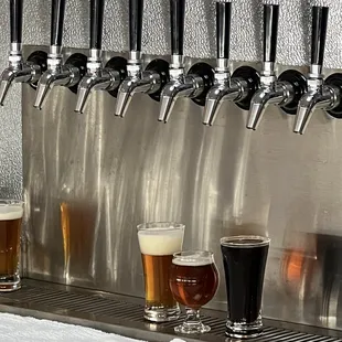 a row of beer taps