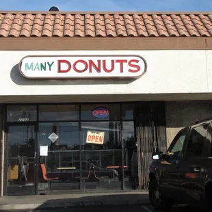 a car parked in front of a donut shop