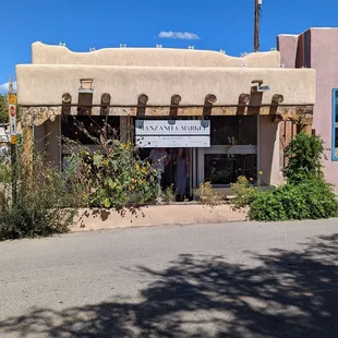 Outside street view. There is also an entrance of the alley/plaza to the left where there are outside tables.