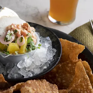 a plate of food and a glass of beer