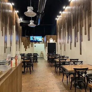 empty tables and chairs in a restaurant