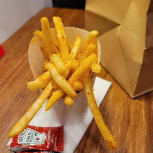 french fries in a paper bowl