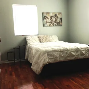 A view of a double-bed in one of our 2-bed, 2-bathroom apartments.