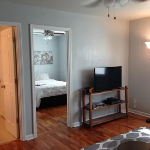 A view into the bedroom and bathroom of one our our 2-bedroom, 2-bathroom units.
