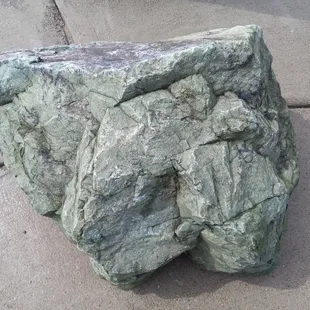 Misty green boulder.