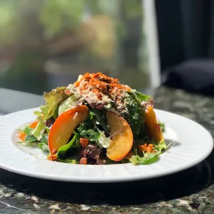 a plate of salad on a table