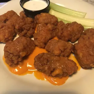 a plate of fried chicken nuggies
