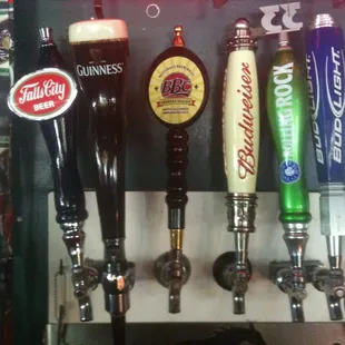 a row of beer taps