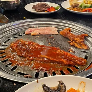 a variety of foods on a grill