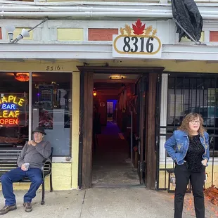 two people sitting on a bench