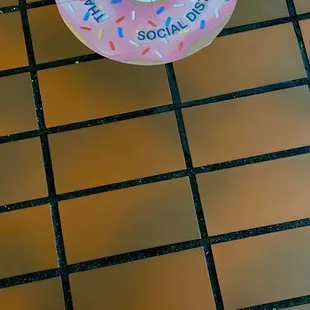 a pink donut with sprinkles on it