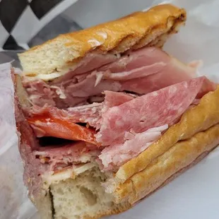 Do yourself a favor get an Italian sandwich. Comes with lettuce and tomato too.