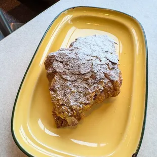 a piece of pie on a yellow plate