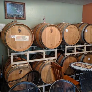 rows of wine barrels and tables