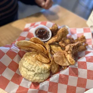 Crispin 4 piece chicken strips with biscuit and house made kettle chips.