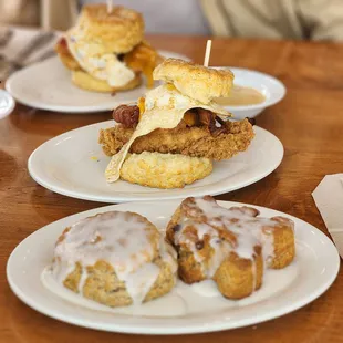 a fried chicken sandwich with a side of donuts