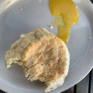 Biscuit with fried egg-- partially eaten!
