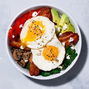 Keto Bowl: Sauteed spinach, mushrooms, avocado, tomato, bacon, two eggs your way, topped with everything bagel seasoning.