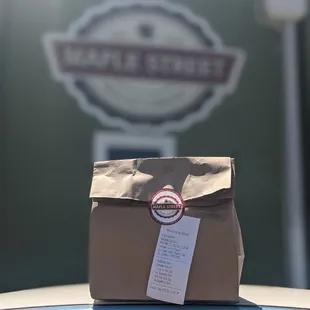 a brown bag on top of a car