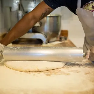Biscuits dough being rolled in our scratch kitchen