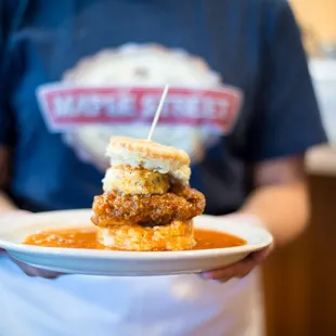 a person holding a plate of food