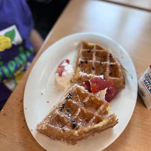 Little Grace: half of a chocolate chip waffle, strawberries, powdered sugar and whipped cream with syrup. Comes with milk OR apple juice