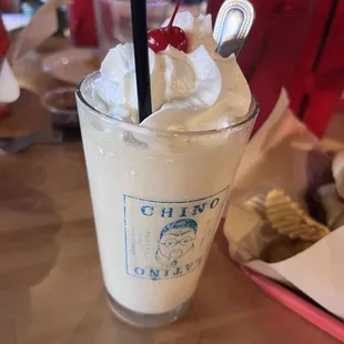 a drink with whipped cream and a cherry