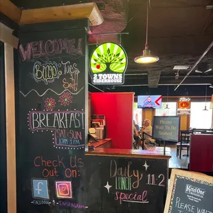 a chalkboard with a sign that says welcome good times