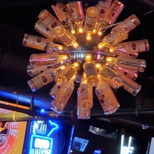 Light fixture made out of bottles.