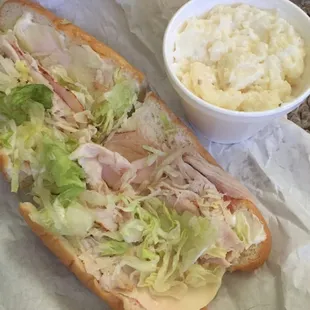 Turkey with provolone , lettuce and a nice side of killer potato salad.