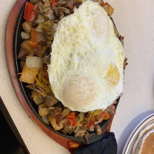 Build Your Own Skillet - bacon, sausage, cheese, potatoes, three fried eggs, and lots of veggies.