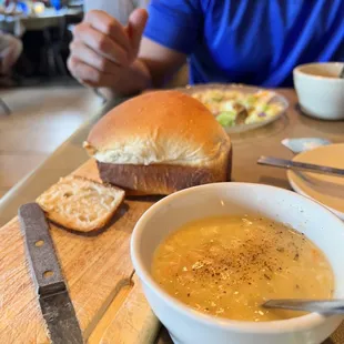 a bowl of soup and a sandwich