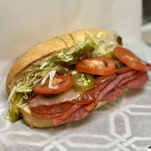 Italian Rambo: Three delicious meats, capacolla, salami, and pepperoni topped with your choice of veggies