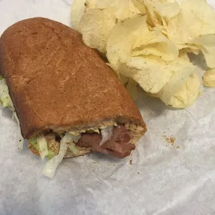 Roast beef with pepper jack cheese on wheat. Side of lays chips
