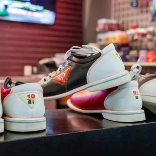 a row of shoes on a counter