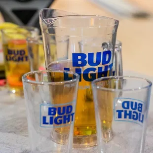 bud light beer glasses on a table