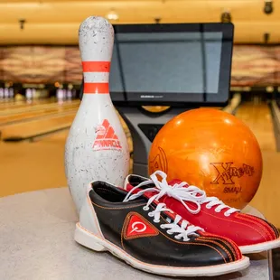 a pair of bowling shoes and a bowling ball