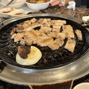 a person eating a meal on a grill