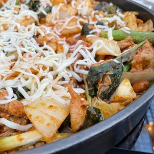 a pan of food with cheese on top