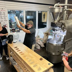 The owner explaining the process of roasting.