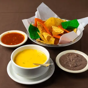 a bowl of tortilla, tortilla and a bowl of soup