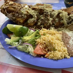 Deep fried snapper coated with garlic butter
