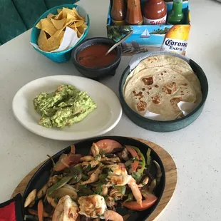Our delicious mixed fajitas with a side of gucamole!
