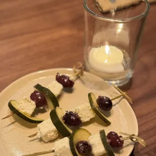 Welcome plate: Amuse bouche of Calamata Olives, pickle cucumber, Cheese