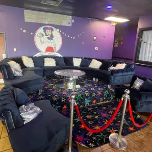 a living room with blue couches