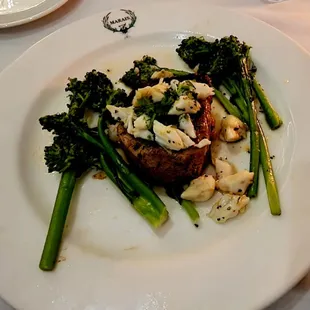 Coffee crusted filet topped with lobster and broccolini