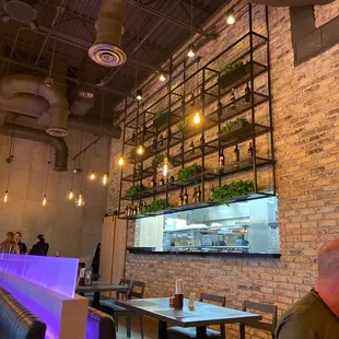 a man sitting at a table in a restaurant