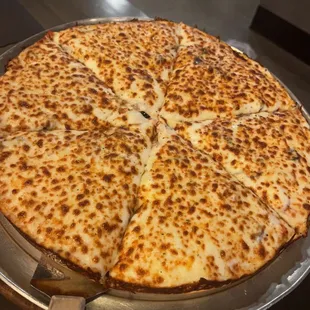 Cuban style pizza. Don&apos;t let this fool you thinking it&apos;s cheese, the toppings are under the blanket of cheese. Medium size