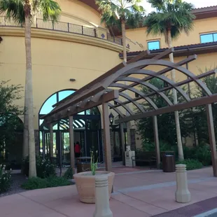 The main entrance through the parking lot