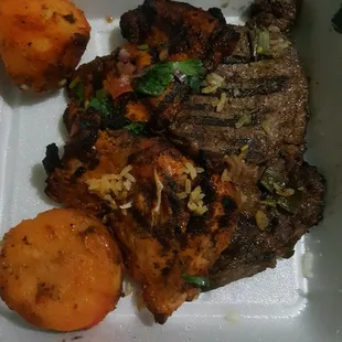 A big piece of steak and two chicken breasts, as well as two potatoes (dusted with a flavorful spicy seasoning) from the meal platters.